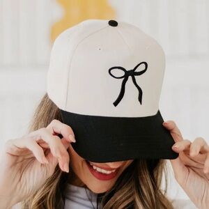 Stylish Black and White Cap with Bow Design